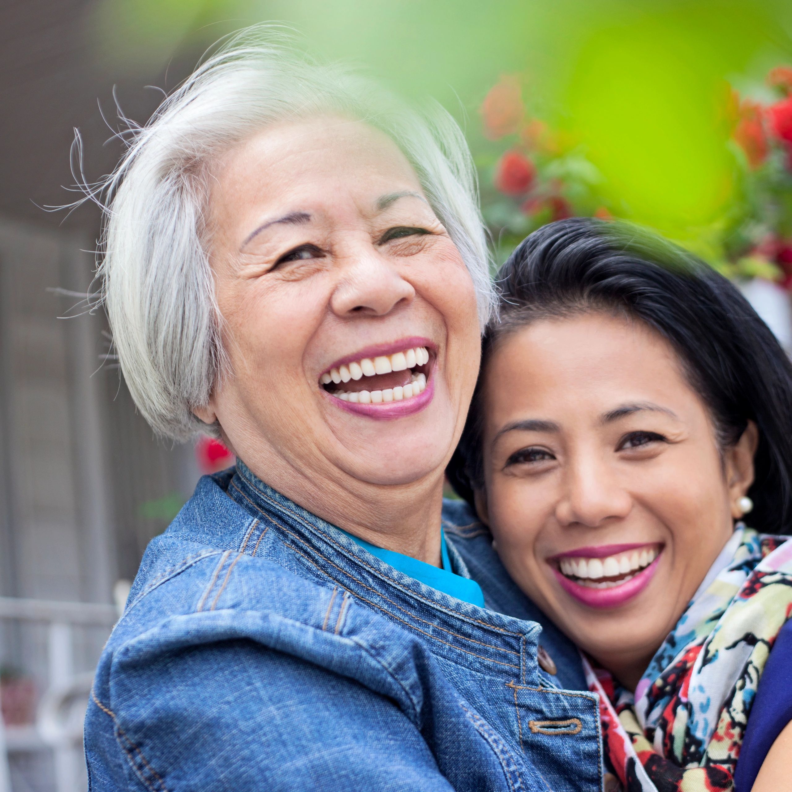 Mature woman with daughter smiling together